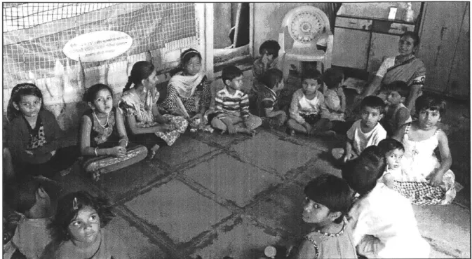 Fig  4: Community  health  worker conducting preventive  health  camp  for children  below age 5 at a  Balwadi