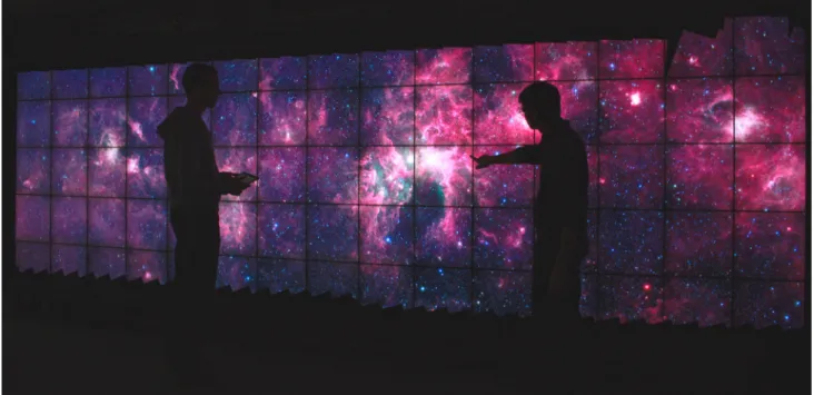Figure 1. Zooming in GLIMPSE360, Spitzer’s Infrared Milky Way image (540,000 × 15,000 pixels), on WILDER, a touch-sensitive ultra-wall at Inria Saclay, France, that features a resolution of 14,400 × 4,800 pixels.
