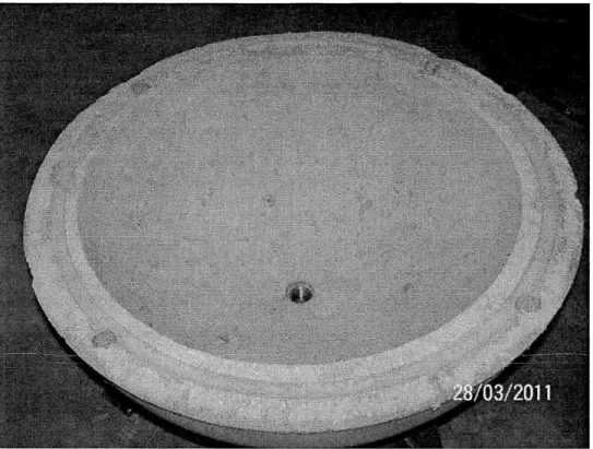 Figure 12 A  concrete hemisphere fresh out of the mold. The pipe coupling can be seen  embedded  in the pole.
