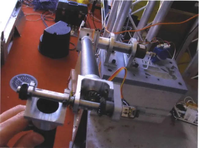 Figure  2-3:  One  of  the  several  acrobot  elbow  iterations.  In  this  case  helical  miter gears  are  used  to  achieve  smoother  operation  along  with  a  spring  between  the two links  pushing  them  apart