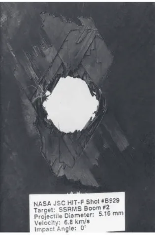 Fig. 1.1: Photographie d’une surface d´elamin´ee apr`es impact, face frontale [1]