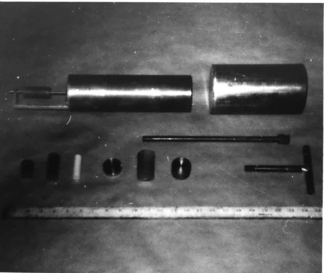 Figure  2.6  Photograph  of Al  Sample  Holder,  Access Port Plugs and  Various  Sample s  Irradiated  in  4TH1  Facility