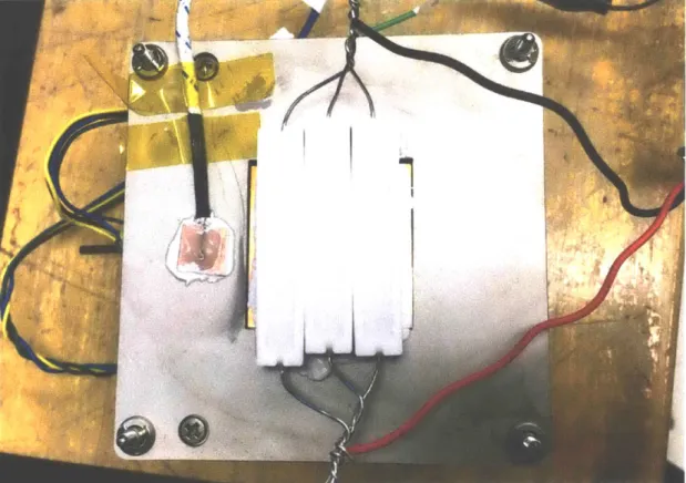 Figure  3-8:  Three  10 (,  10 W  power  resistors  were  wired  in parallel  and  placed  on  the radiator,  alongside  a  thermocouple.