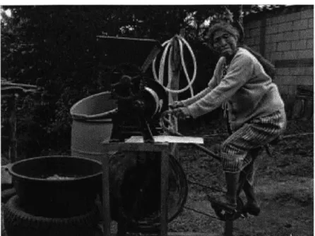 Figure 4: A  Guatemalan woman  uses  a pedal-powered  grinder made from old bicycle parts.