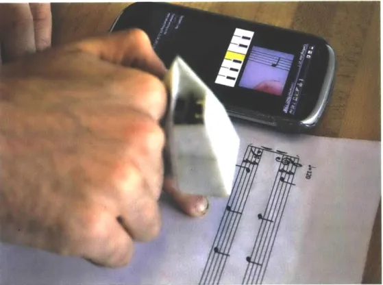 Figure  3-7:  The  sheet  music  reading  system.  A  user  points  his  finger  at  a  note  and hears  it  played  out  and  displayed  on  screen