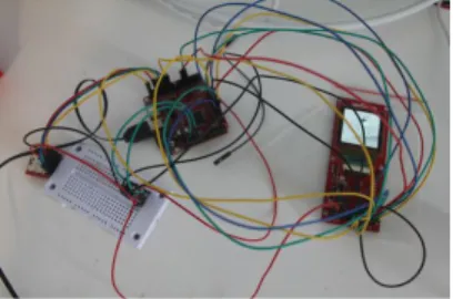 Figure 7. Circuitry prototype for  one cube face. The picture shows  the three main components on each  face: an OLED display, a  micro-controller and a memory card