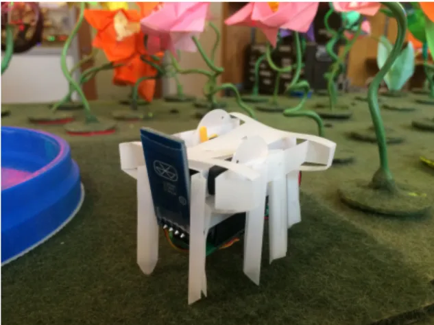 Fig. 2. A self-folding crane is magnetically controlled across the surface of a pond.