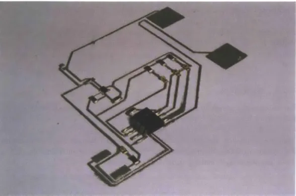 Figure 4.17:  Capacitive plates at upper right, prior to cutting and folding. The circuit is not con- con-nected to power in this photo, which was supplied through the rectangular pads at lower left.