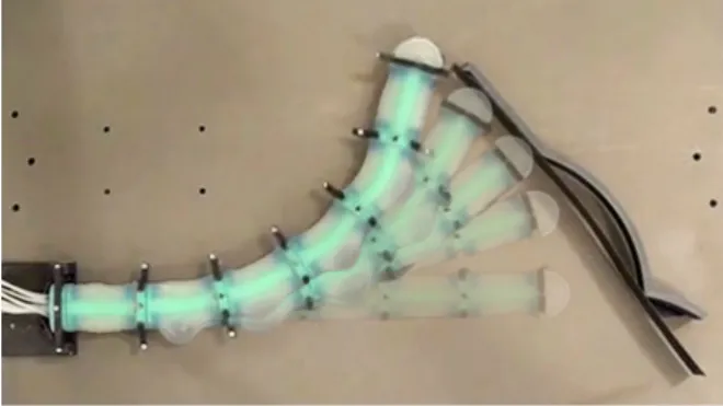 Fig. 1. Dynamically controlled soft robot approaching and then tracing along an environment