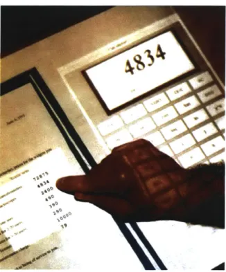 Figure  3-2:  The  Digital  Desk  by  Pierre  Wellner  allowed  users  to  interact  with  pro- pro-jected  information  overlaid  on  real  paper.