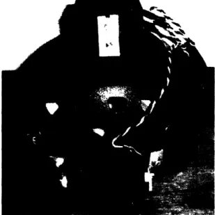 Figure  4: Complete helmet apparatus with side-mounted head pitch  and top-mounted head yaw  sensors connected to junction  box in back