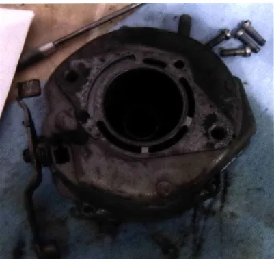 Figure 8:  Bottom of carburetor  before refurbishing.  Notice  gasket had  stuck to the surface.