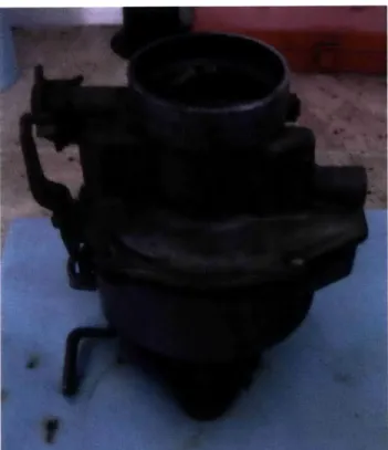 Figure 4:  Carburetor  removed  from the engine before  refurbishing.  There is noticeable  buildup on the surfaces  of the carburetor.