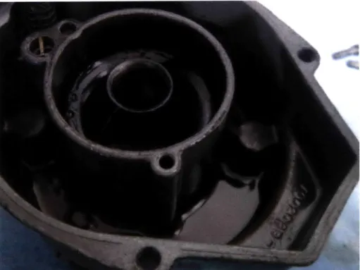 Figure 6:  Carburetor  bowl before refurbishing.  Notice sediment  left in the bottom  after fuel was poured  out.