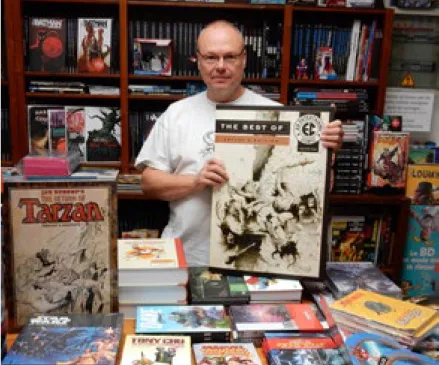 Fig. 2: Tony Larivière, proprietor of the Atomik Strip comic store  (Andenne, Belgium), presenting an IDW Artist’s Edition volume