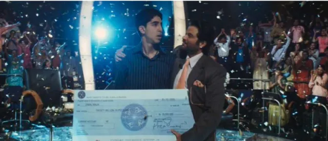 Fig. 3: Jamal receives a giant check from gameshow host Prem Kapur (played by Anil Kapoor)  after winning the top prize