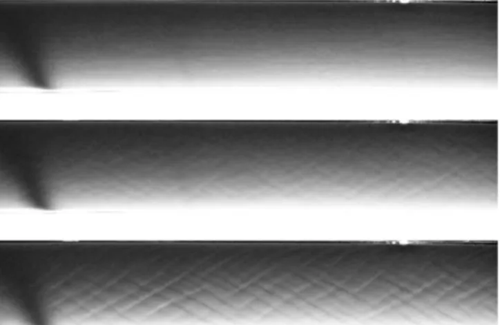 Figure 5. Development of a rhomboid instability on the granular bed of a laminar channel (flow is from right to left).
