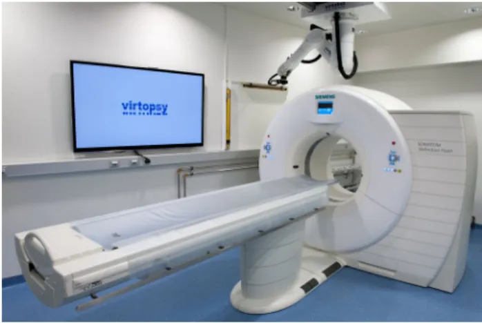 Fig. 3 Tool stand during automatic tool change. Left to right surface scanner, digital photo camera for photogrammetry and biopsy module