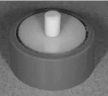 Fig. 1.  Yttrium-stabilized tetragonal zirconium polycrystal disc speci- speci-men embedded in poly(methyl methacrylic) with the cespeci-mentation  surface exposed