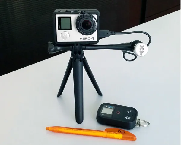 Figure 3.4. GoPro HERO4 with an external directional microphone, a tripod, and a Wi-Fi remote controller.