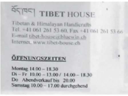 Figure 2.  Trilingual inscription on the door of a Tibetan shop in Basel