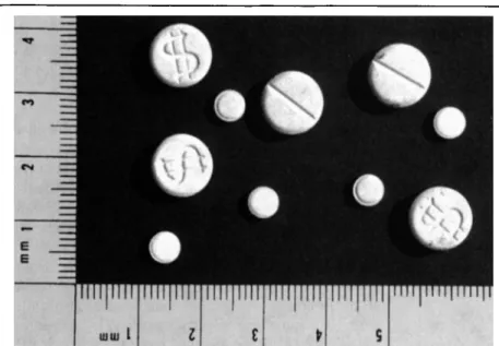 Figure  2.  Photographs of the two sets of seized tablets (sample A with $ imprint).  Dimensions are  in millimeters
