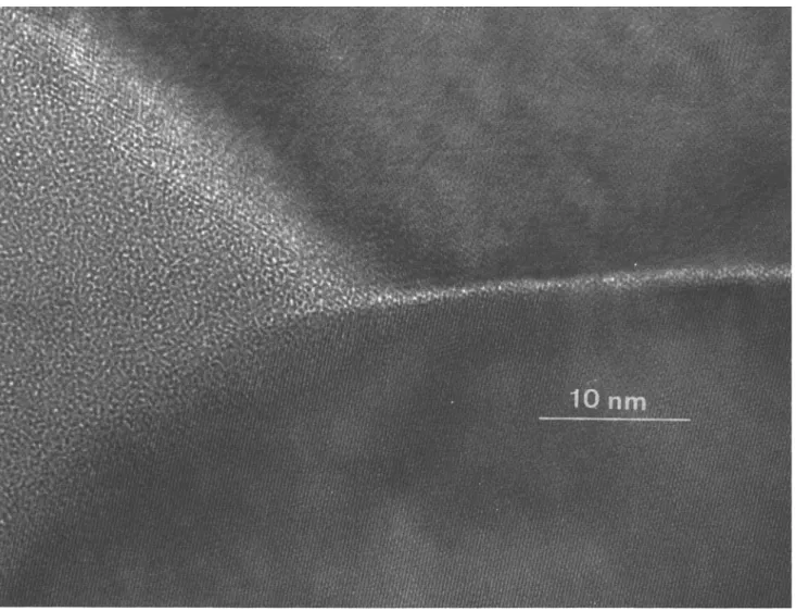 FIG. 7. HREM of a triple-point junction and an intergranular glass film (sample C-10).