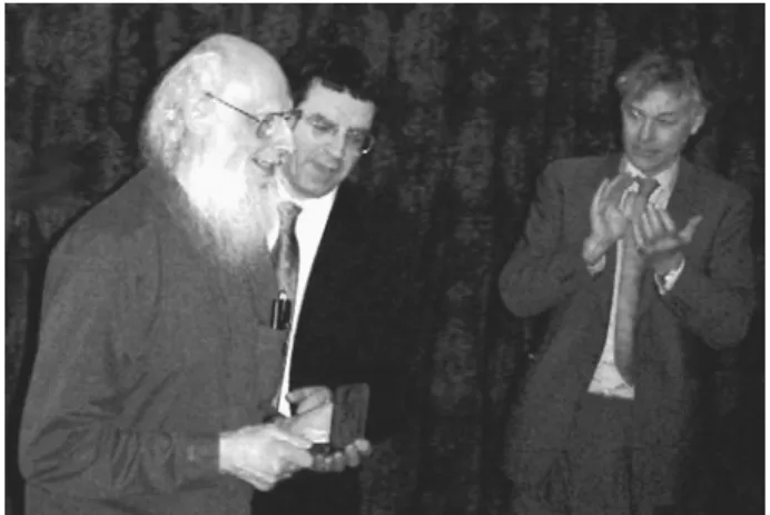 FIGURE 1. The author, Professor R. Solomonoff (left), receiving the Kolmogorov medal on the occasion of the inaugral University of London Kolmogorov Lecture, organized by the Computer Learning Research Centre, at Royal Holloway on February 27th 2003