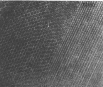 FIG. 5. HRTEM of a 2212 grain after 10 h of annealing showing a high density of 2201 intergrowths on the right side ([010]-orientation).