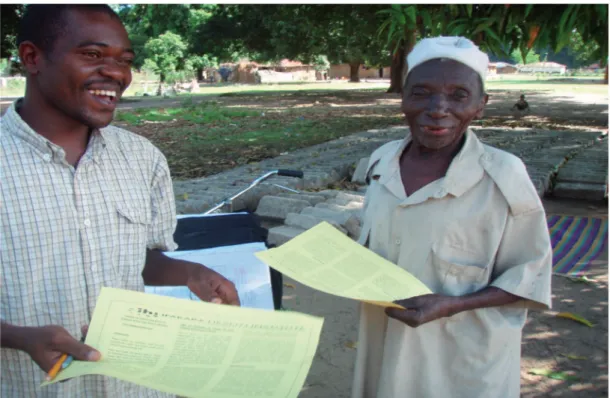 Figure 5. Rufiji HDSS field interviewer provides a news letter to the Rufiji HDSS member, as one of the feedback mechanisms.