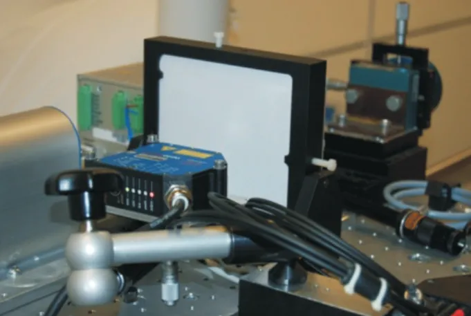 Fig. 3. Target KaH on trolley (center); triangulation sensor temporari- temporari-ly set up for checking target adjustment (foreground).
