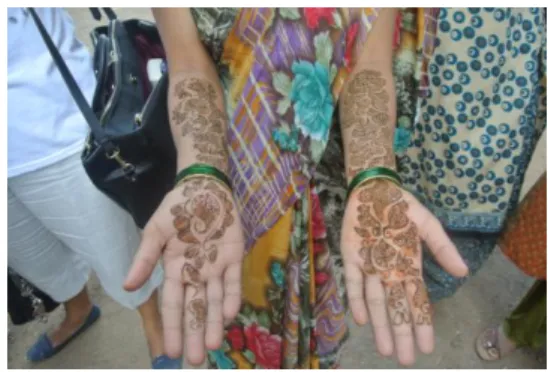 Figure 10: Hands covered with henna after the class 