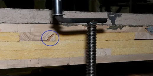 Fig. 3.6. Transverse shear cracking (blue circle) between layers 2 and 3 in a transverse wooden strip.