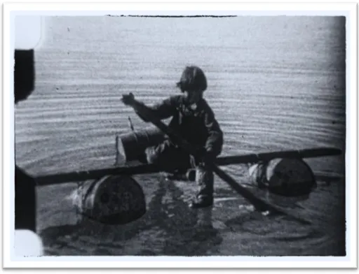 Figure 1: Aipilik Inukshuk fishing from a makeshift raft. Frame enlargement from film [Inuit Scenes at 