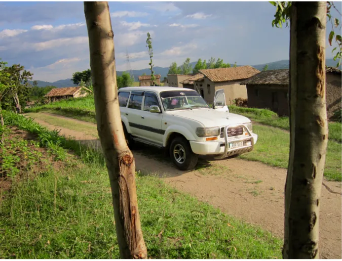 Figure 4: A vehicle rented by EvaP parked in a village, between houses and fields. Credit: author’s picture