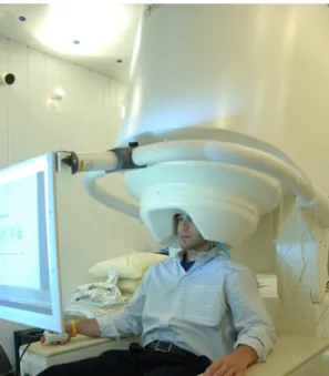 Figure 1.7 – Patient undergoing a cognitive experiment in a MEG scanner. Courtesy of National Institute of Mental Health.