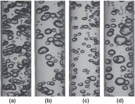 Fig. 7. Flow visualisations for bubbly flows, DT sub ¼ 12  C; q = 2 W/cm 2 , (a) G ¼ 540 kg=m 2 =s in 1 ÿ g, (b) in l ÿ g and (c) G ¼ 220 kg/m 2 /s in 1 ÿ g, (d) in l ÿ g.