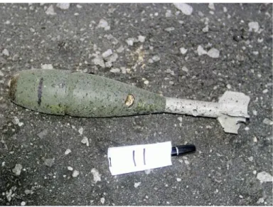 Figure 29. Projectile impacted by fragments  from a mortar detonation 157 cm away (trial # 11) 