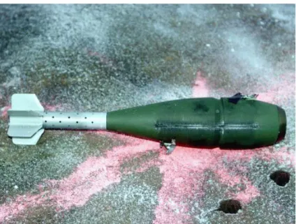 Figure 26. Effect of a 16.3 g C4 shaped charge  with 5.7 g initiating C4 ball on projectile casing (trial #2) 