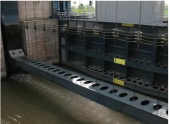 Figure 3. Movable ship arrestor net by a vertical lift gate during  lifting,  Bernhard  Lock  on  the  Amsterdam-Rhine  Canal,  The  Netherlands (photo by R