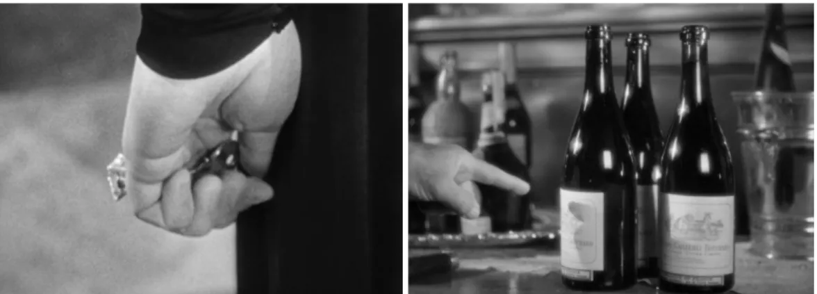 Figure 1. La main d’Alica (Ingrid Bergman), ainsi que des bouteilles de vin. 