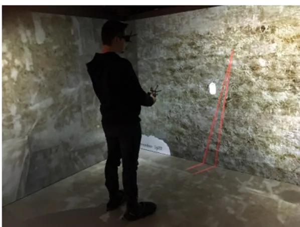 Figure  1:  Participant in the EON  ICUBE  CAVE  using the  application “King Tut VR2” 