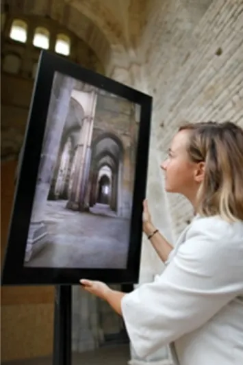 Fig. 9 Onsite augmented reality device called ray on: This screen is adjustable (orientation) and displays what the user would see if the abbatial church had not been destroyed