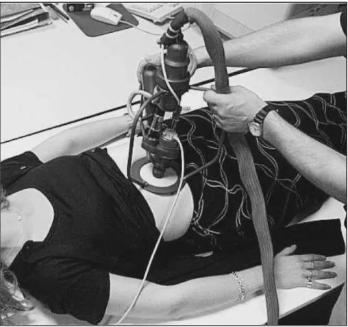 Figure 1.3 The TERESA robot in US scanning, held by a paramedic  (Vieyres et al., 2003) 