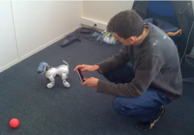 Figure 6: In our new prototype, the iPhone ac- ac-celerometer can be used as a TUI to orient the robot head.