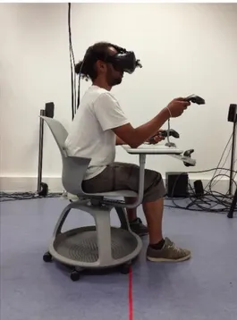 Figure 2: The workstation inside the virtual environment. The mobile  chair  and  the  tablet  are  modelized  and  tracked  via  Vive  tracker