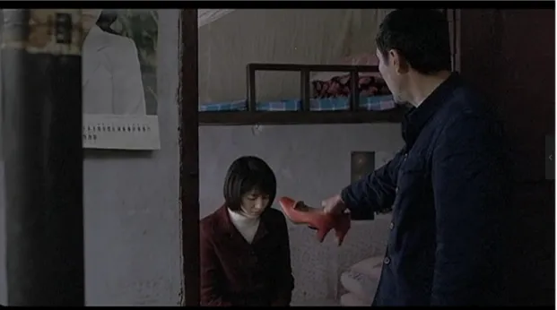 Figure 1: Shanghai Dreams (2005) – Lao Wu criticizes Qinghong for accepting Xiaogen’s red leather shoes.