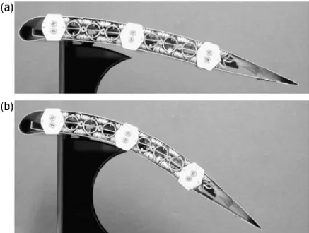 Figure 2.13 Bending achieved in a prototype aircraft wing by heating of SMA strips. (a) Un-morphed and (b) morphed  [49]