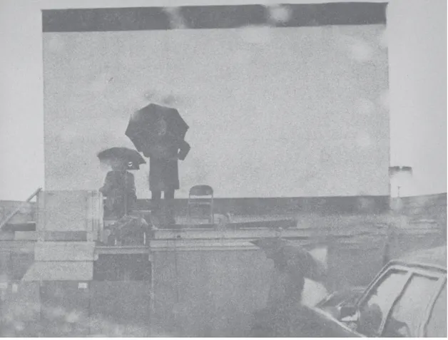 Fig. 2 - Schuller on top of a snack bar at drive-in theater. 