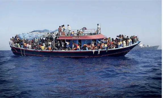 Figure 5. Guardian, © Photograph: Giuseppe Lami/EPA, with caption: “Migrants are taken to the mainland  after being rescued by the Italian navy last September”